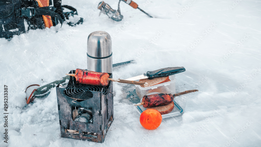 Firebox oven, cooking in a winter camping trip. Bushcraft.