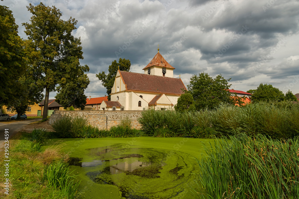 Rural Czech village Zizkovo Pole (Žižkovo Pole) with a beautiful village church dedicated to Saint Michael - Czech Republic.