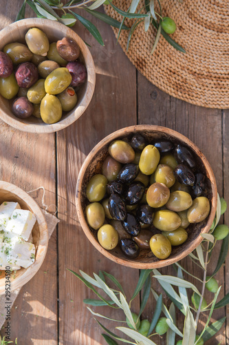 bowls with different kind of olives : green black kalamata olives with olive oil