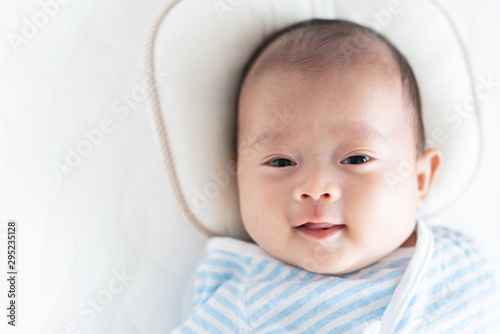 Baby lying on a crib