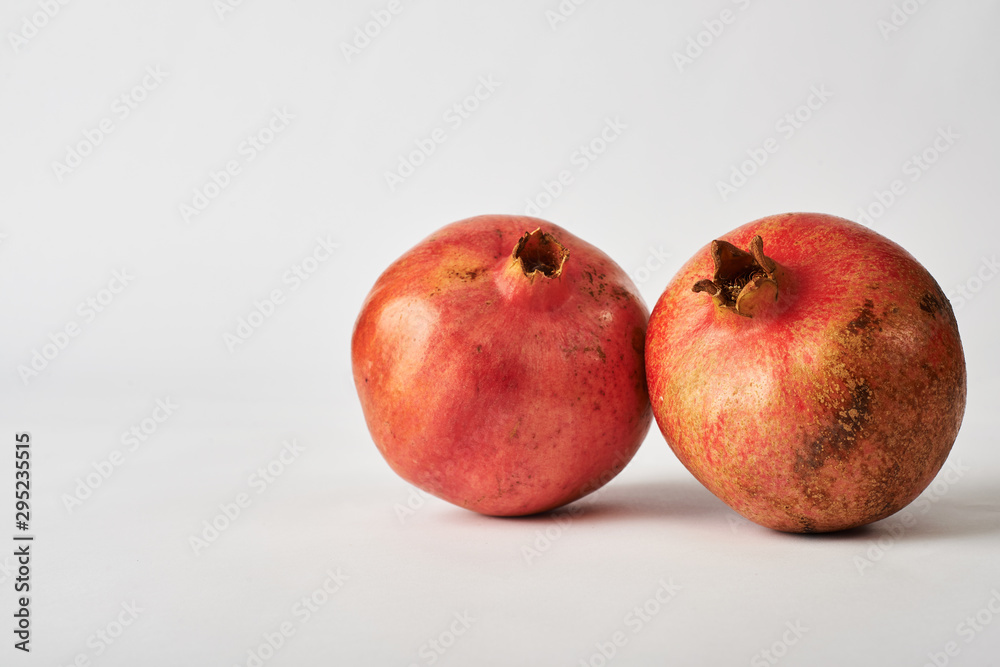 pomegranate fruits on white background. pomegranate fruits on white background.
