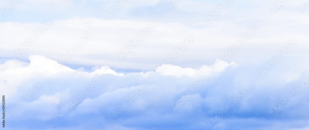 Beautiful puffy clouds isolated against blue skies