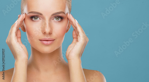 Beauty portrait of healthy and attractive woman. Human face in a concept of spa, skin care, cosmetics, make-up, complexion and face lifting.