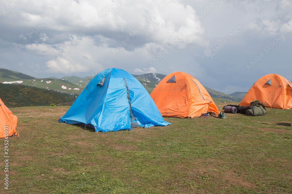 Tents Camping area, early morning with green grass, Georgia. travel, vacation Tents Camping area, early morning with green grass, Georgia. travel, vacation