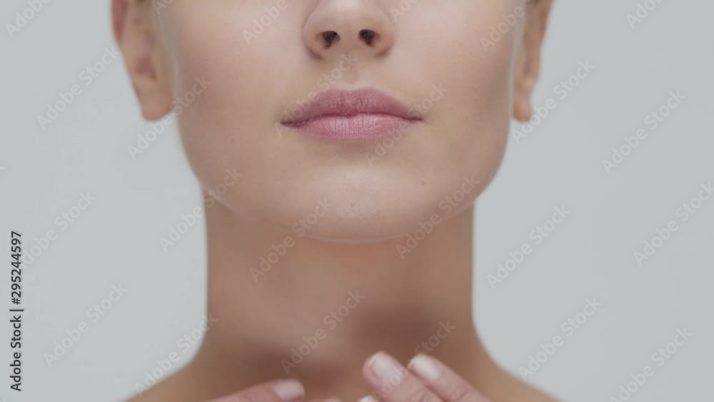 Studio portrait of young, beautiful and natural blond woman applying skin care cream. Face lifting, cosmetics and make-up. Studio portrait of young, beautiful and natural blond woman applying skin care cream. Face lifting, cosmetics and make-up.