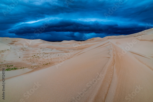 Storm clouds over sand dunes in the desert