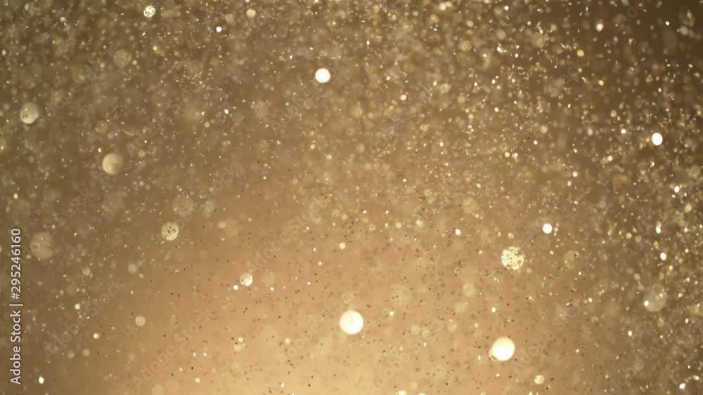 Golden Glitter Background in Super Slow Motion at 1000fps. Shooted with High Speed Cinema Camera in 4K Resolution. Golden Glitter Background in Super Slow Motion at 1000fps. Shooted with High Speed Cinema Camera in 4K Resolution.