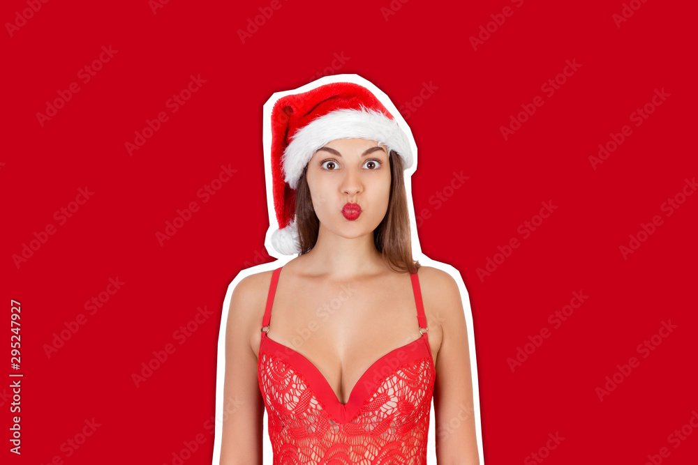 Amazing funky teen woman posing in christmas hat. Magazine collage style with trendy color background. Happy Christmas and New Year holidays concept Amazing funky teen woman posing in christmas hat. Magazine collage style with trendy color background. Happy Christmas and New Year holidays concept