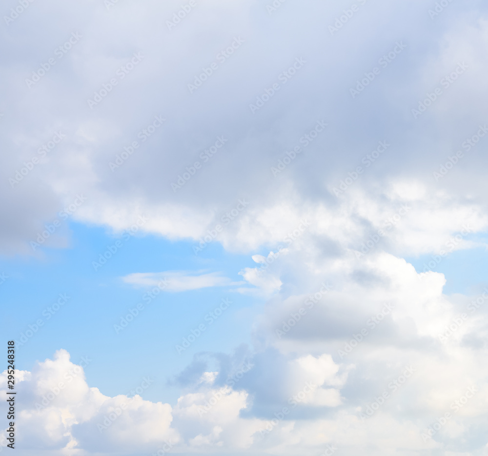 Beautiful puffy clouds with sun beams against blue skies. Beautiful puffy clouds with sun beams against blue skies.