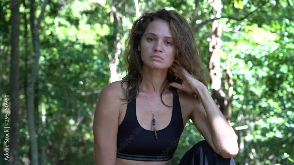 No, denying offer gesture by beautiful girl. Portrait of a young caucasian brunette girl on nature, at tropical garden in summer, Thailand, close up. No, denying offer gesture by beautiful girl. Portrait of a young caucasian brunette girl on nature, at tropical garden in summer, Thailand, close up.
