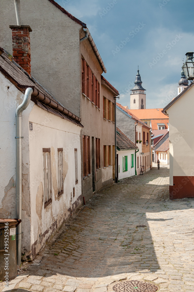 Street view with the St. James church in the background at the city of Telc, Vysocina Region, CZ