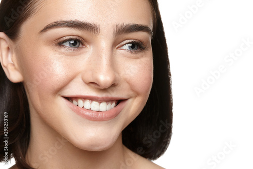 girl with nude make-up with blue eyes closeup