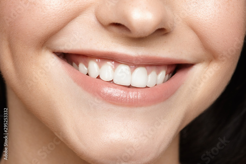 close-up of a smiling girl with white teeth