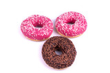 Top view of two pink and one chocolate donut on white background
