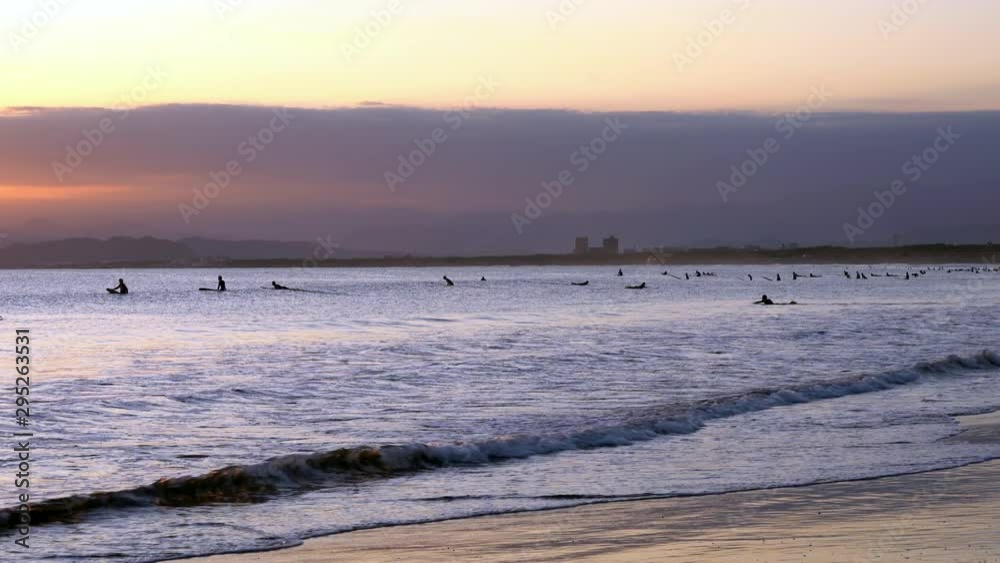 Surfers in the evening Surfers in the evening