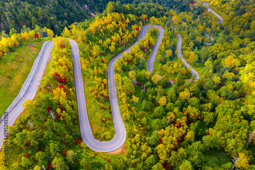 Aerial view of winding road on mountain in Autumn