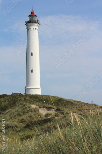 Lighthouse  Lyngvig Fyr near Ringkobing in Denmark  on a sunny summer s day.