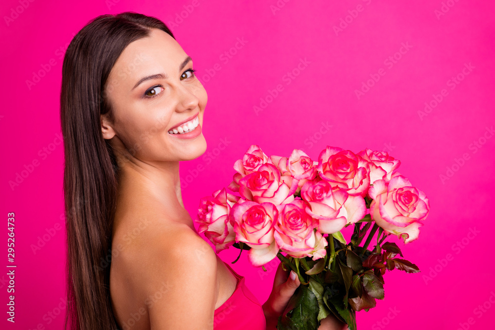Close-up profile side view portrait of nice attractive lovely cheerful long-haired girl holding in hands cute organic bouquet isolated on bright vivid shine vibrant pink fuchsia color background Close-up profile side view portrait of nice attractive lovely cheerful long-haired girl holding in hands cute organic bouquet isolated on bright vivid shine vibrant pink fuchsia color background