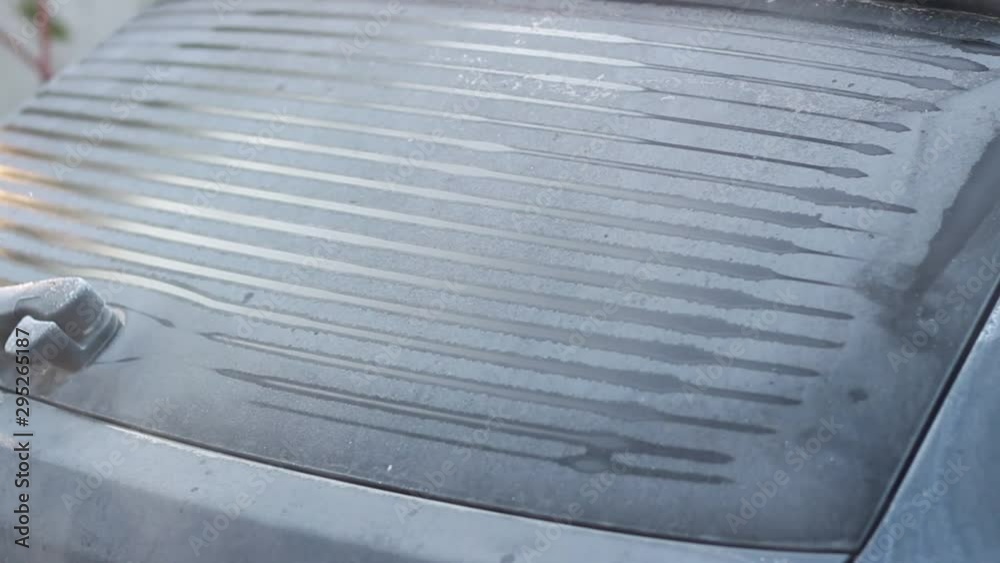 Defrosting lines on glass. The rear window of the car is heated by