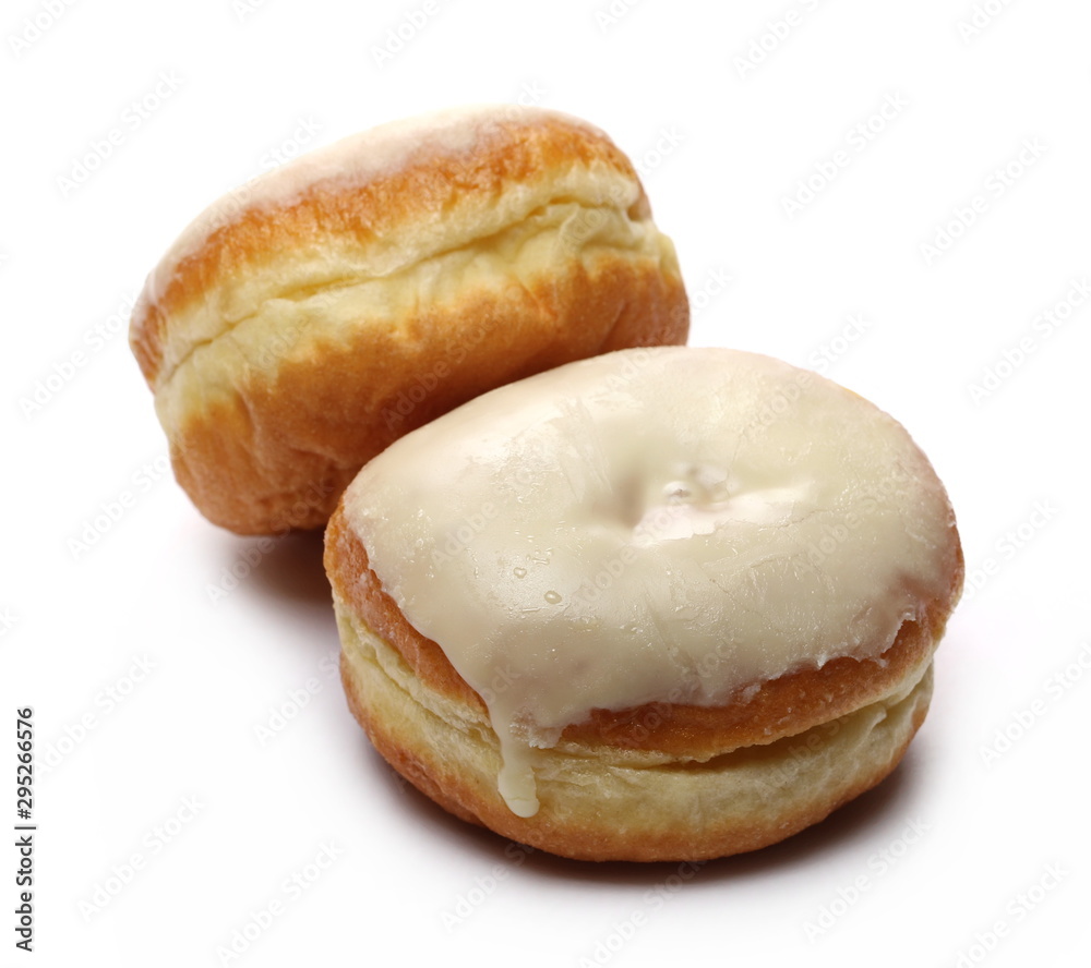 Doughnuts with vanilla cream icing isolated on white background Doughnuts with vanilla cream icing isolated on white background