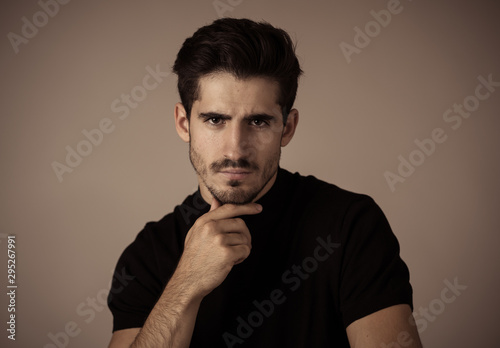 Young attractive latin man posing looking sensual and handsome. Beauty concept and lifestyle