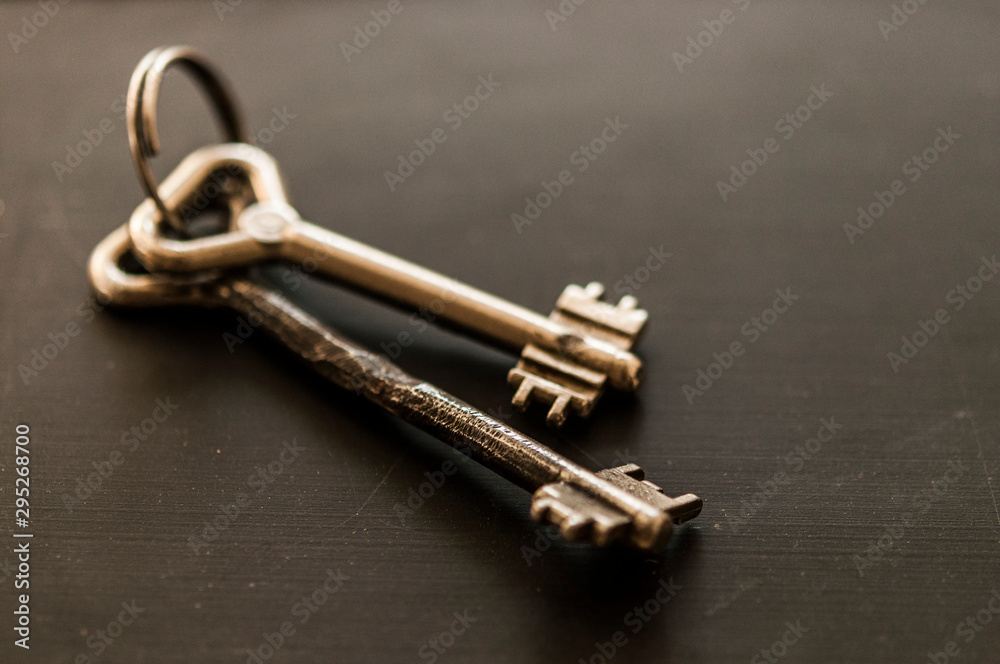 bunch of old keys on wooden background bunch of old keys on wooden background