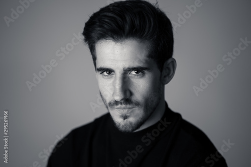 Young attractive latin man posing looking sensual and handsome. Beauty concept and lifestyle