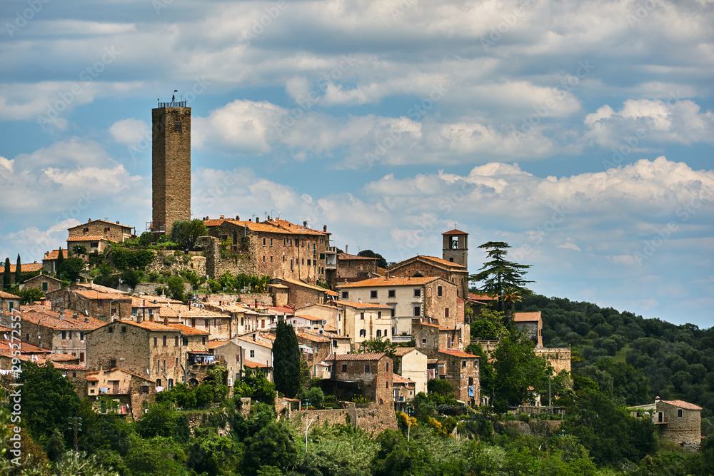brick, medieval tower and belfry of the city of Pereta in Tuscany.