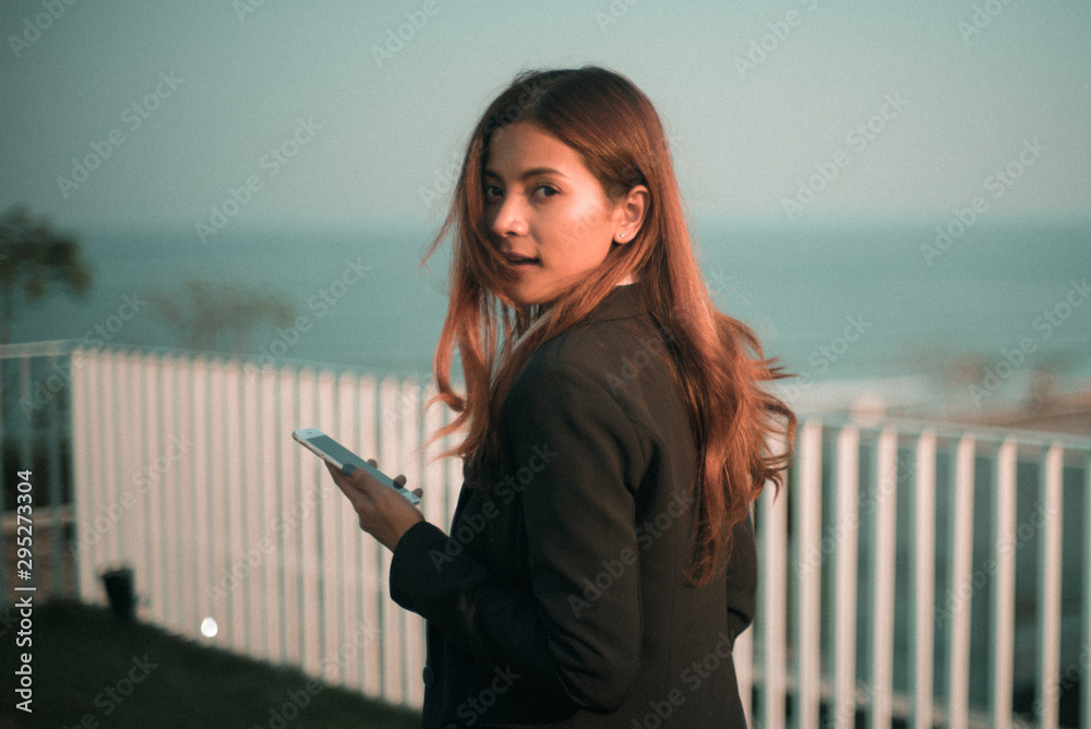 Fototapeta premium Asian business girl with smart phone