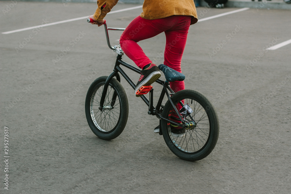 Fototapeta premium boy has fun with his BMX at the skatepark