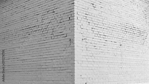 Brick wall painted with white paint.