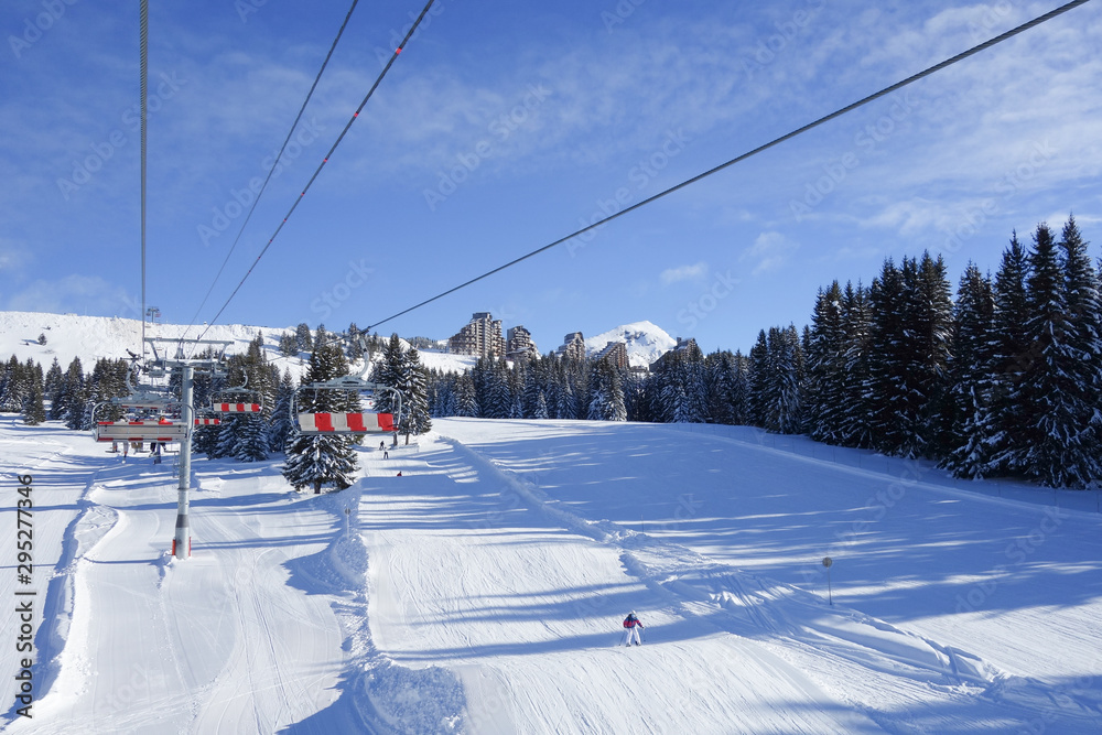 Ski lift taking people to the snow covered slopes in the winter sport resort of Avoriaz, France. Ski lift taking people to the snow covered slopes in the winter sport resort of Avoriaz, France.