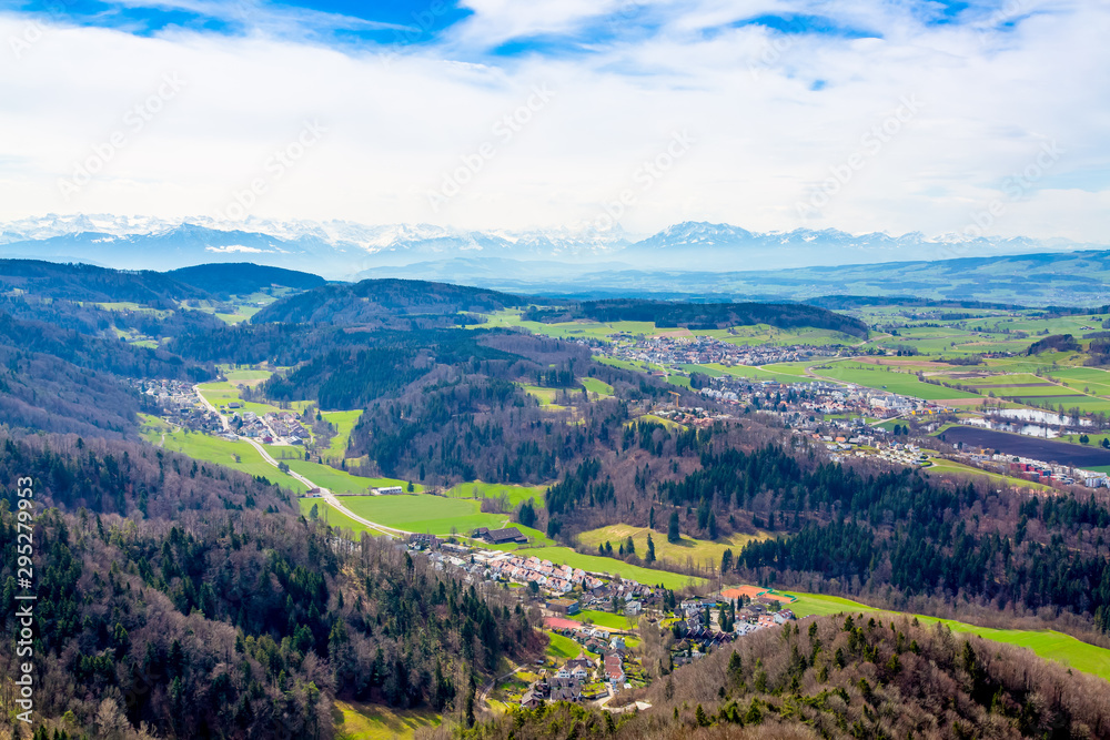 Fototapeta premium Panorama of alps and towns Wettswil, Stallikon and Bonstetten from odservation tower on Uetliberg mountain
