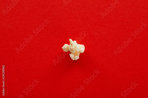 top view of sweet popcorn on red background