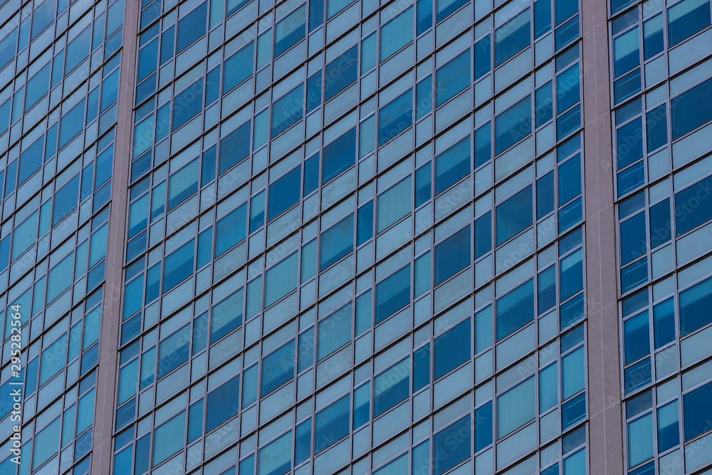 The background of the window of a multi-storey building is shot closeup.