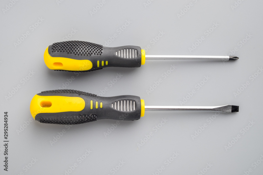 Screwdrivers on grey background Screwdrivers on grey background
