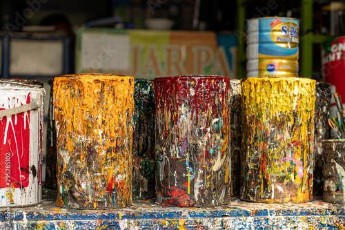 Fotografija Used paint pots covered in paint drips and splatters in Jakarta Indonesia