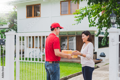 Asian delivery man deliver box parcel package to customer at home, shipping delivery concept