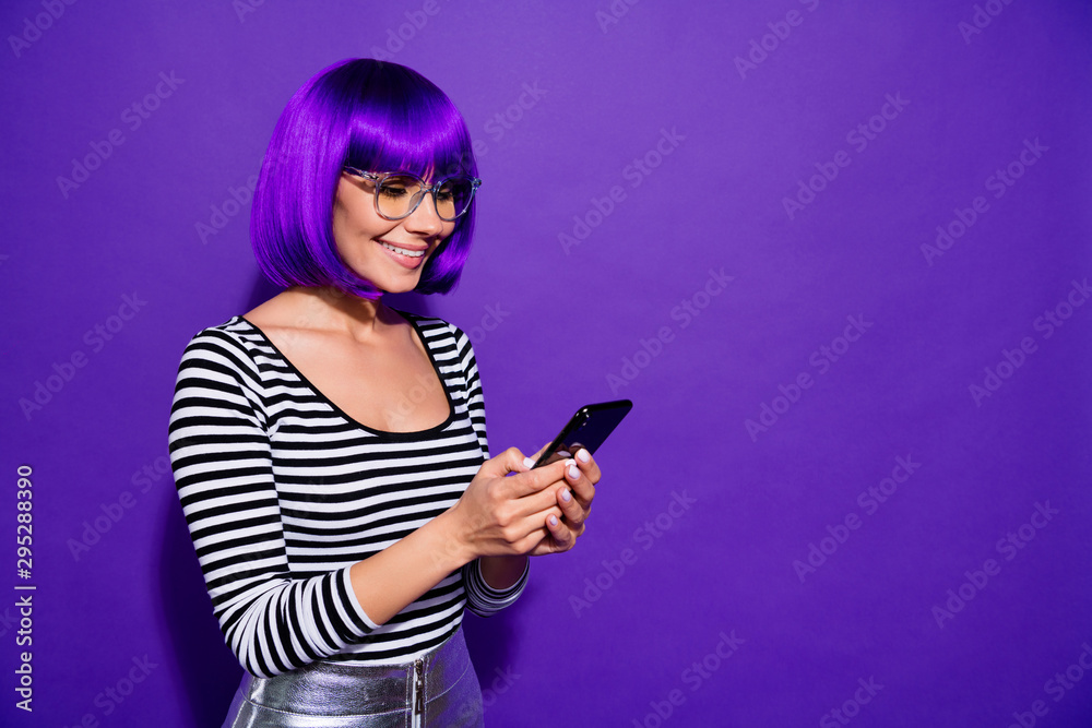 Portrait of charming youngster using modern technology reading news isolated over purple violet background Portrait of charming youngster using modern technology reading news isolated over purple violet background