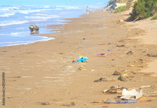 Fototapeta Naklejka Na Ścianę i Meble -  drifted plastic waste on a beach in the mediterranean pollution of the ocean with microplastics,environment protection concept