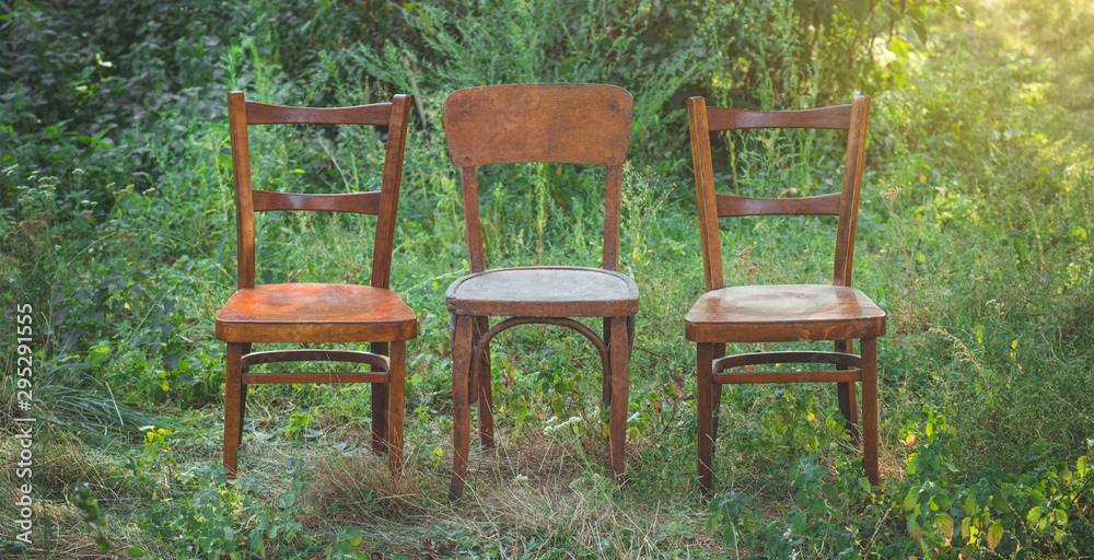 Pair old wooden chair outdoors. Two wooden folding chairs for rest. Pair old wooden chair outdoors. Two wooden folding chairs for rest.
