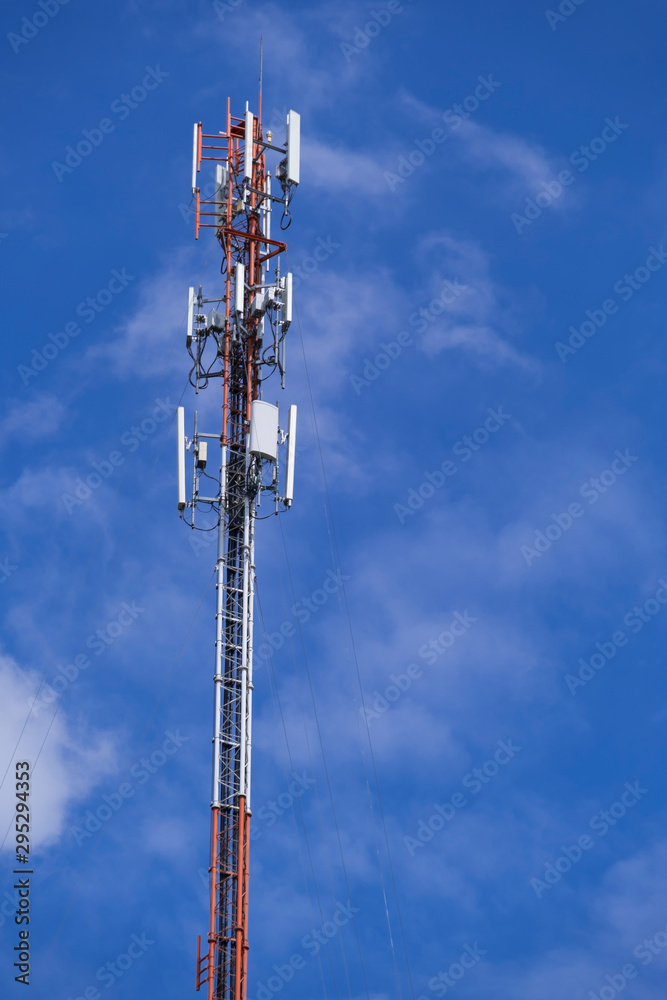 Telecommunication telephone signal transmission tower with beautiful blue sky and cloudy background Telecommunication telephone signal transmission tower with beautiful blue sky and cloudy background