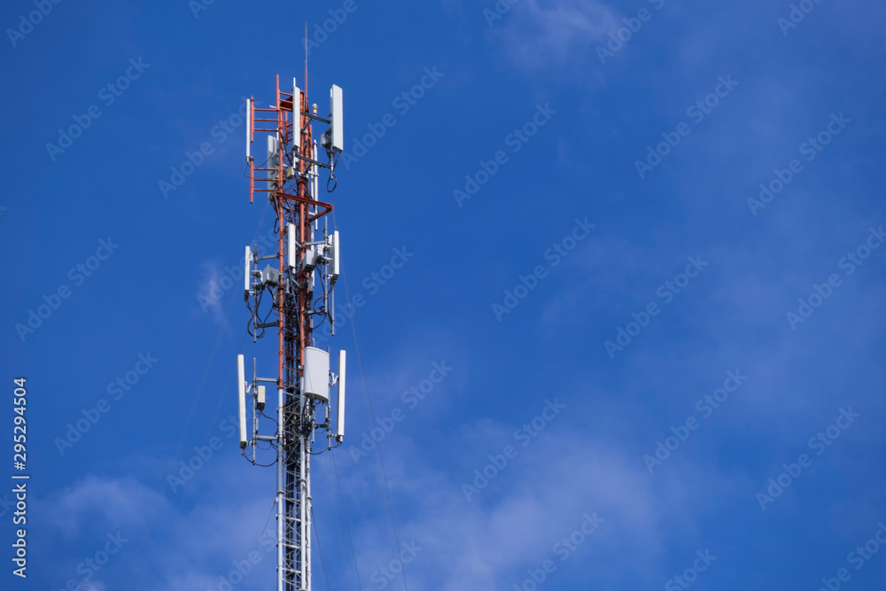 Telecommunication telephone signal transmission tower with beautiful blue sky and cloudy background Telecommunication telephone signal transmission tower with beautiful blue sky and cloudy background