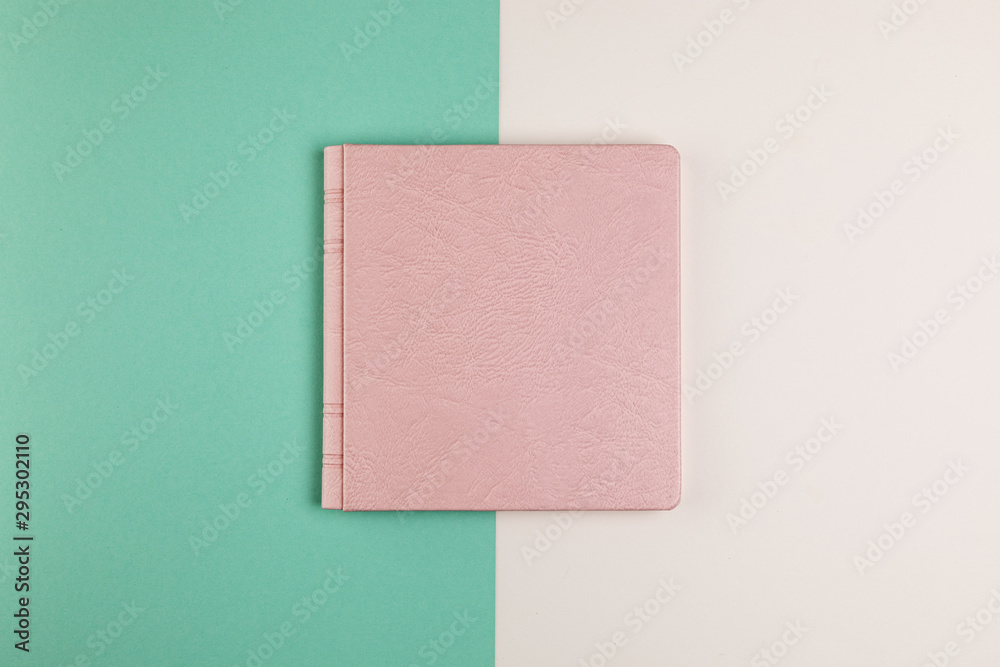 Flat lay closed book with colourful background Flat lay closed book with colourful background