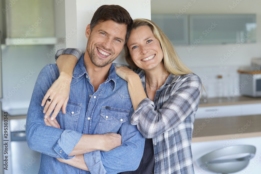 Portrait of cheerful middle-aged couple at home Portrait of cheerful middle-aged couple at home