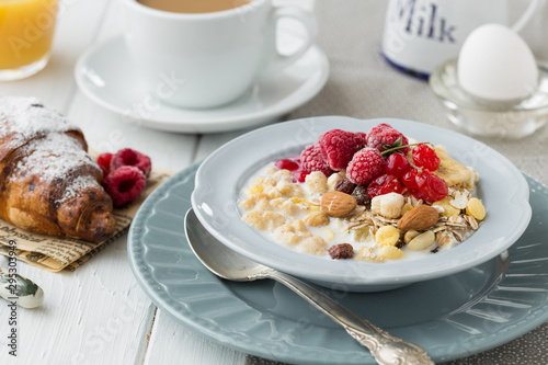 Breakfast Cereal, Table setting. Healthy tasty breakfast multigrain wholewheat healthy cereals with raspberries, black currants and red currants.