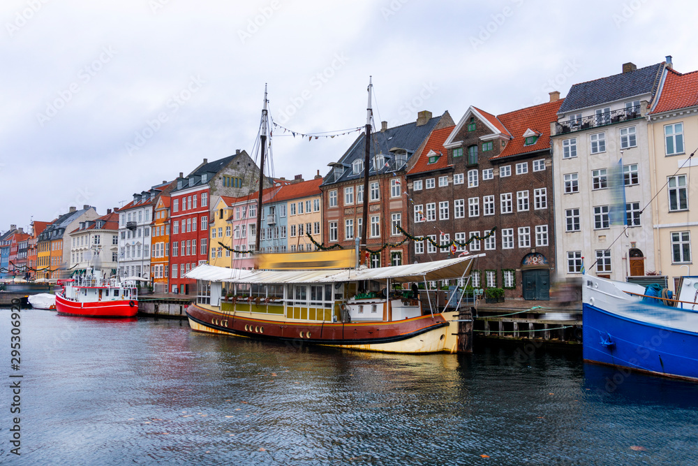 Denmark. The most popular promenade in Copenhagen is Nyhavn. Bright multi-colored facades of old houses.