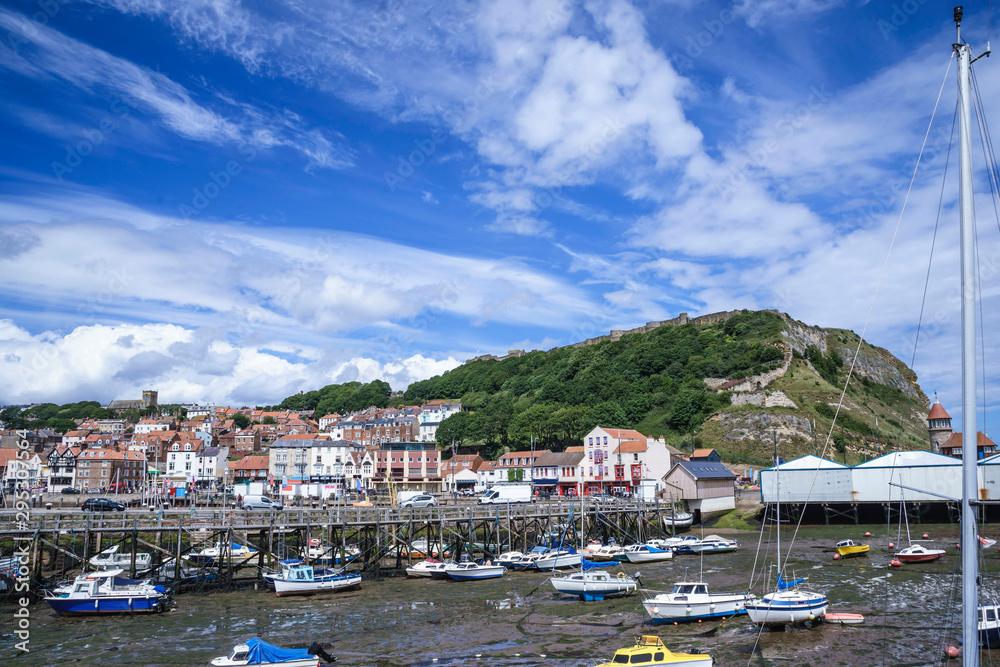 Looking towards Scarborough Castle from the Old Pier, Scarborough Harbour, Yorkshire, England, UK.