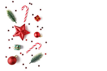 Christmas Red decorations, fir tree branches on white background.