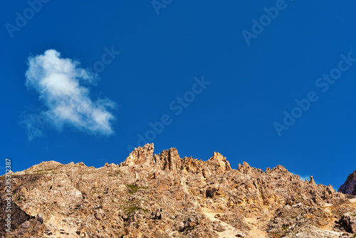 jumps towards the refuge path tower of Pisa latemar (predazzo pampeago) dolomites alto adige Italy photo